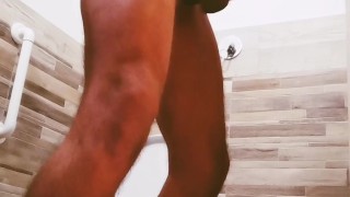 A guy with a big cock locked the toilet and masturbated. Long slow cumshot. 