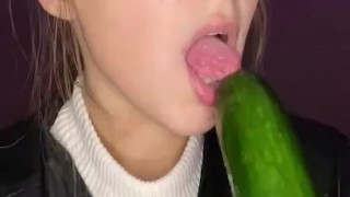 Cucumber sucking. Leather jacket 