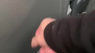 Stroking in a construction porta potty. 
