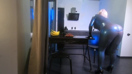 Latex rubber fetish curvy milf woman in blue texturized catsuit. Backstage from the photoshoot.