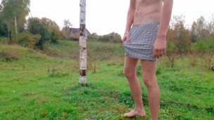 Russian guy is watched as he masturbates on a village football field