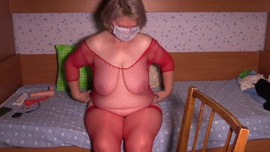 Busty milf in stockings shows off her chubby figure in front of a webcam. Big boobs and juicy booty.