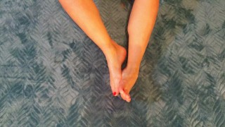 Cutie puts lub on her feet and plays with them FOOT FETISH