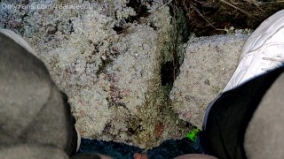 Peeing outside on the frozen grass