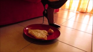 High heels and barefoot crush of a cream cake