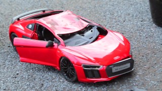 Crush of Red Audi R8 model toy car with Black Pump Stilettos