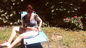 Nicoletta sunbathes in a public garden wearing a big dirty diaper