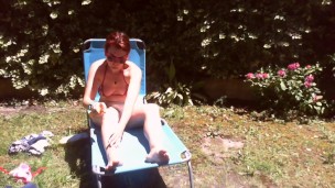 Nicoletta sunbathes in a public garden wearing a big dirty diaper
