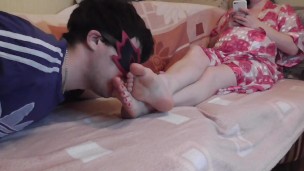 I lick my wife's feet while she chatting with her lover