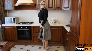 mature LADY SHOWS HER STOCKINGS AND A GARTERBELT