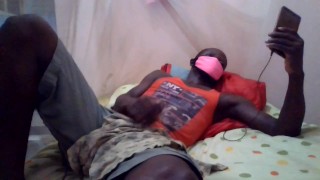 YONG LAD JERKS OFF AND CUM LAYING AND WATCHING PORN