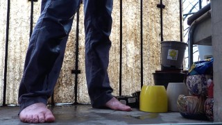 Desperate pee in jeans on the balcony