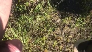 Peeing off tailgate outdoors 