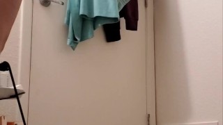 Asian changing in her room