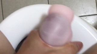 Masturbating in the bathroom, I fucked that stroker so hard and came inside