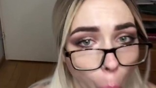 A blonde in a checkered skirt sucked a strap-on