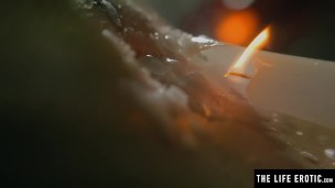 Sexy brunette squirting as she fucks herself with a lit candle