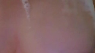 Girl washes boobs in bubble bath