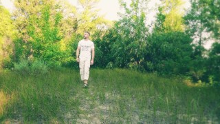 The guy jerks off and cums in a forest clearing
