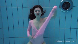 Roxalana Cheh wearing pink dress in the pool