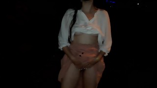 Naked girl walking in the city at night