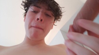 Sucking New Dildo on Wall