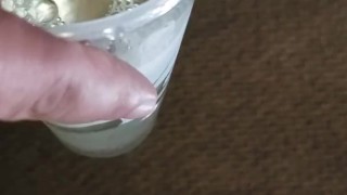 Small cock pissing into cup - urination