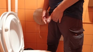 pee in a public orange toilet