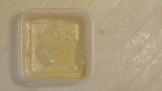 Pissing into the plastic case.