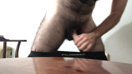 Long hairy horny guy watching porn handjob cumshot on table