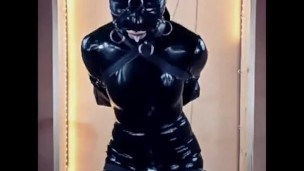Latex doll in bondage gagged and blindfolded