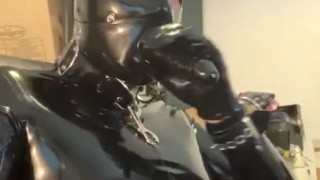 Full rubber gimp enjoys dildo gag