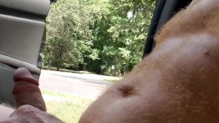 Naked hairy ginger playing with dick while a guy watches and a guy passes on a motorcycle