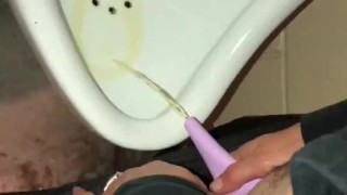 Girl Pissing into a Urinal & her Husband gets to Witness it first hand as he pisses right after her