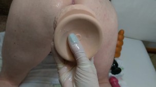 The mistress put her slave in cancer and fucked with a big dildo and a huge butt plug. Femdom