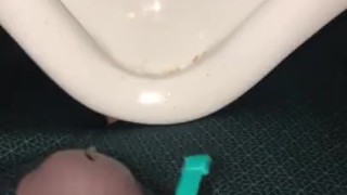 Using a hollow Cock Sleeve Packer Device to go Pee into a Urinal for the first time
