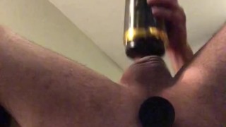 Hot guy strokes his big cock with spinning stroker with plug