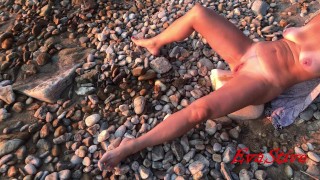 pissing lying on the seashore