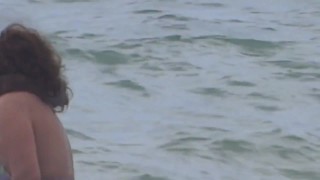 Latina mature shows off on the beach and has sex with the hotel guard, big cumshot on her hairy puss