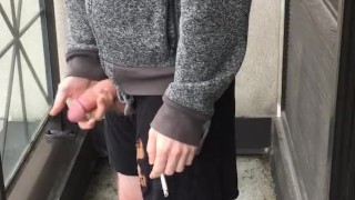 Skinny exhibitionist shows boner on public Toronto balcony while smoking
