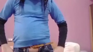 Cute crossdresser sissy boy in a skinny jeans with a dick outside from a zip.