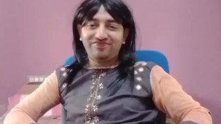Young sissy crossdresser femboy in a cute little dress on the chair.