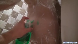 Showering solo teen masturbates under the water