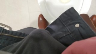 Uncut cock pisses at public toilet through big foreskin and dribbles on underwear