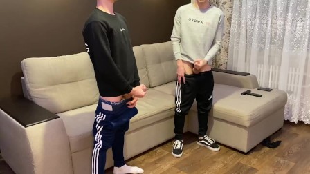 Two friends jerk off in sporwear
