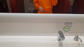 Blondy in public toilet touching horny ass