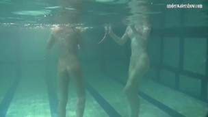 Russian lesbian girls swimming in the pool