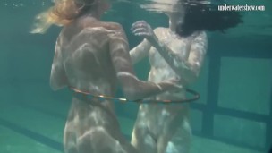 Russian lesbian girls swimming in the pool