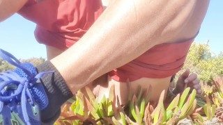 Sexy guy touches his dick and sticks his finger up his tight ass in a public place