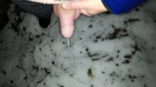 Pulling back foreskin and peeing to the snow